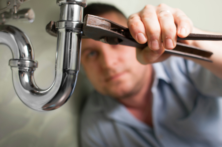 plumber-repairing-sink-howard-county-rental-property