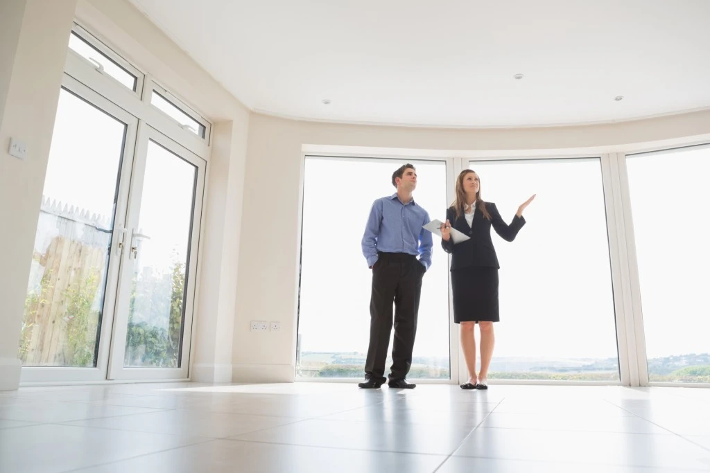 First Impressions are Important to Help Tenants Feel Welcomed in Your Rental Woman presenting the rooms of Prince George's County rental property