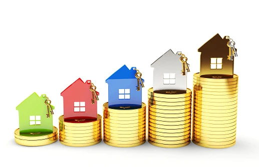 toy houses above stacks of coins, getting progressively taller