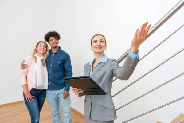 Property manager showing a rental home to prospective tenants