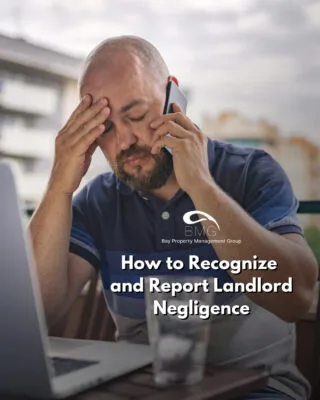 Man stressed while talking on phone at a laptop, representing landlord negligence concerns