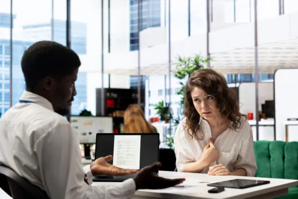 Property manager discussing a rental application during the tenant screening process