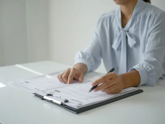 Property manager reviewing applicant information during a tenant reference check