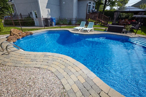 Well-maintained rental property with a swimming pool that enhances curb appeal