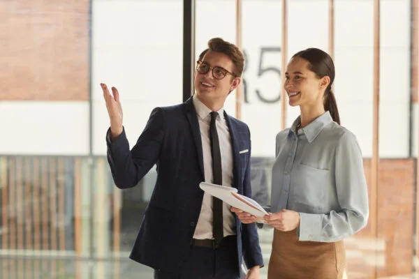Property management professionals discussing rental management services