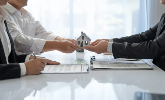 Property owner meeting with a property management professional to discuss a rental home