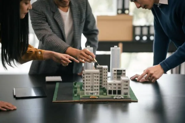 Property professionals discussing the management of a real estate investment