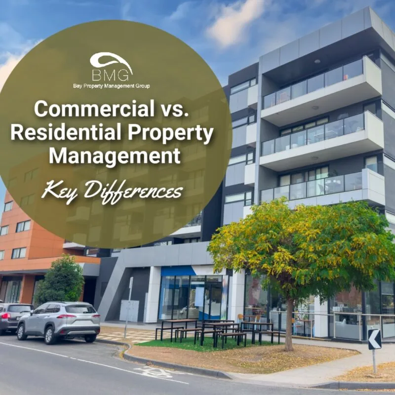 The image shows a modern apartment building with parked cars and a tree in front. The text overlay reads: "Commercial vs. Residential Property Management: Key Differences," along with the logo for Bay Property Management Group.