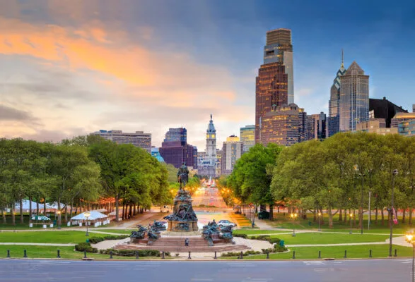 sky-high buildings in Downtown Philadelphia against sunset backdrop