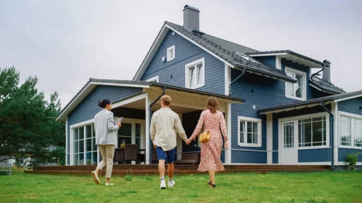 Leasing agent showing a couple a rental property during a house tour