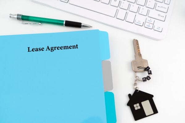 Lease agreement with house key, symbolizing a tenant’s first chance to accept terms under the right of first refusal