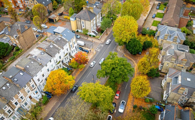 Aerial view of residential buildings and homes representing multiple rental properties covered under one blanket insurance policy.