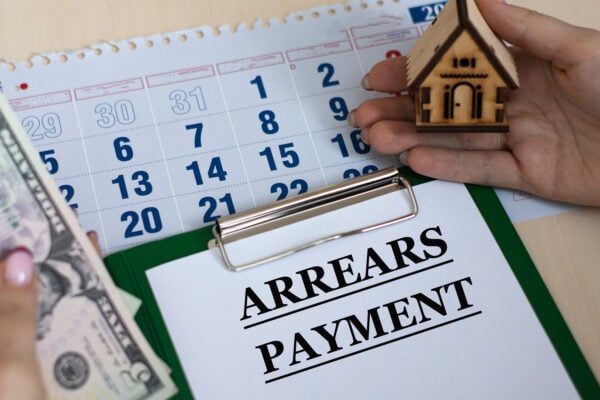 arrears payment notice with calendar and rent money showing what rent in arrears means for tenants