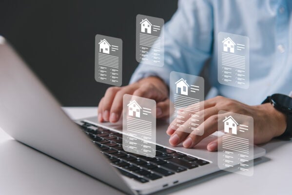 Landlord managing digital rental documents on a laptop for better record-keeping