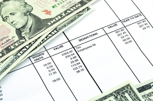 Paystub shows amount of earn with banknotes and coins