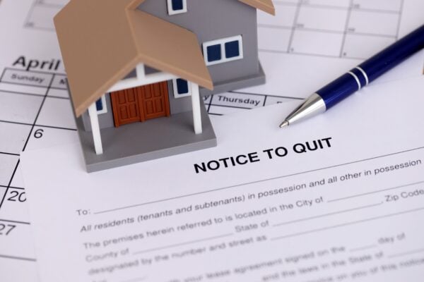 Three-day notice to quit document with rental property and calendar in Baltimore