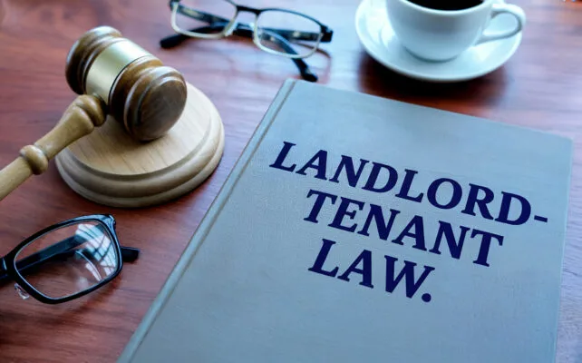 Landlord-tenant law book representing security deposit and rental laws