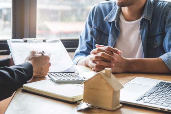 Landlord reviewing paperwork before properly serving a three-day notice