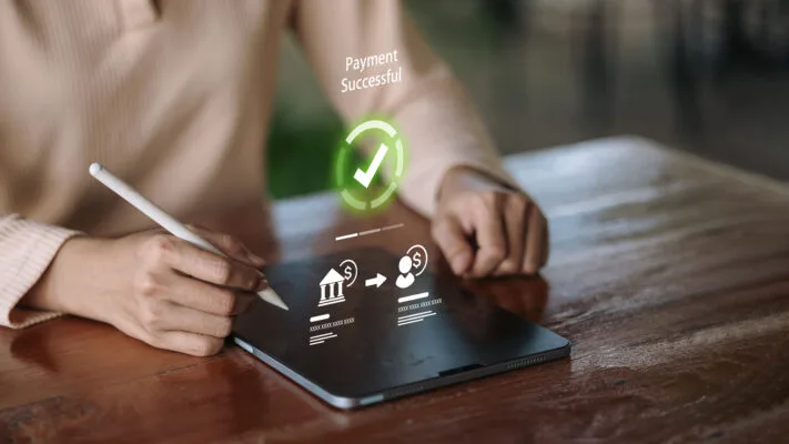 Tenant paying rent through an online portal using a tablet.