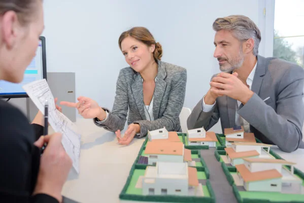property manager explaining property management services to landlords