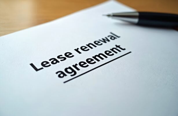 lease renewal agreement document on desk for rental property decision