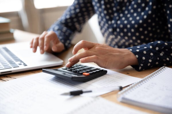 renter calculating budget and reviewing finances for apartment application