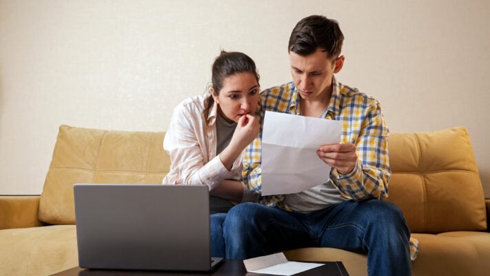 enants worried while reviewing lease agreement before moving in
