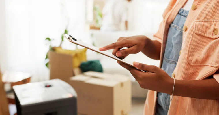 Landlord reviewing rental property inspection checklist during move-in or maintenance check