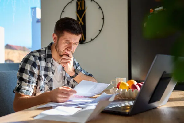 Landlord reviewing eviction documents to avoid common eviction mistakes