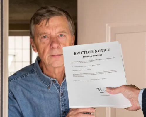 Landlord serving an eviction notice to a tenant at the rental property