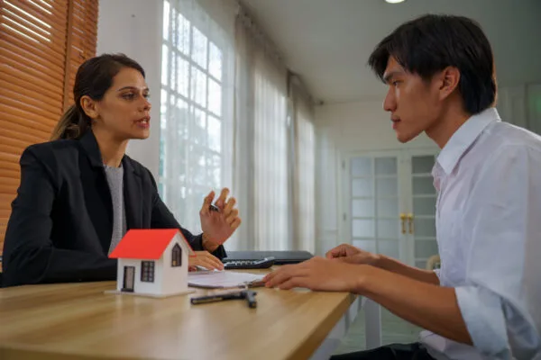 Property manager reviewing rental criteria with a prospective tenant