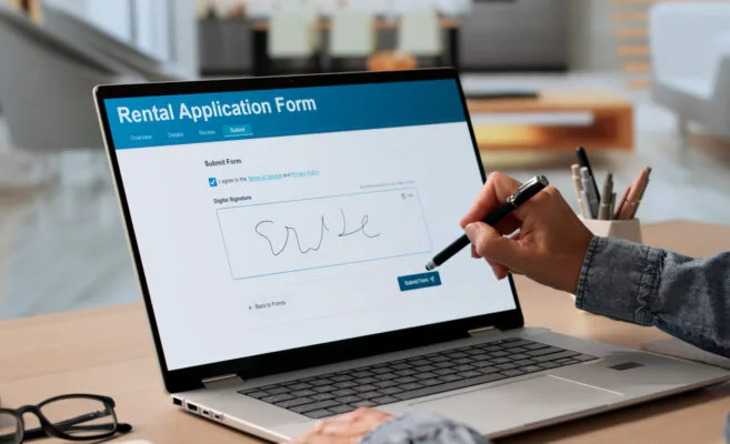 Rental application form being completed online on a laptop