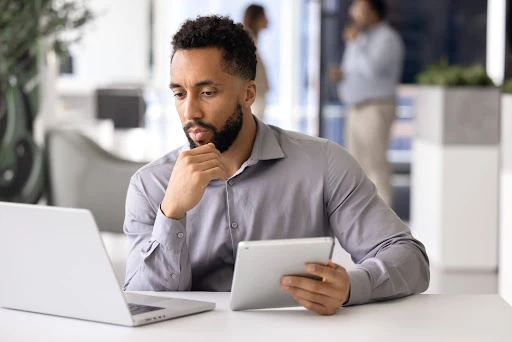 Landlord reviewing tenant information to avoid common screening mistakes.