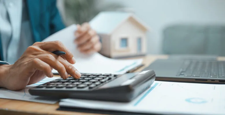 Prospective landlord calculating rental property costs before investing