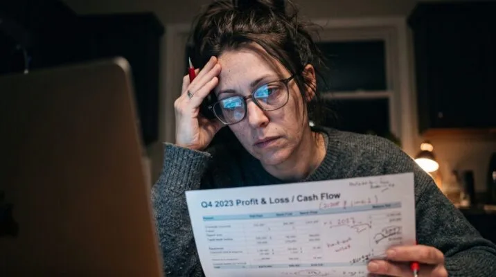 Landlord reviewing financial records while managing rental property responsibilities