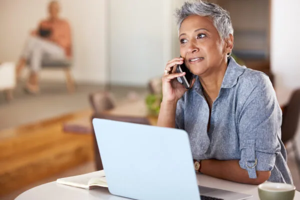 Rental property owner talking on the phone about property management services